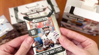 YouTuber opens football cards live, gets surprise facial