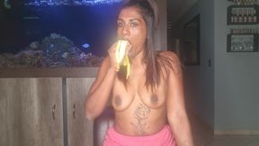 Topless Desi Squeezes Her Boobs as She Sucks and Deepthroats on a Banana