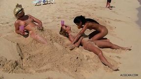 Dirty naked blonde girl is cuddling her bad bestie’s gentle pussy, while on the beach