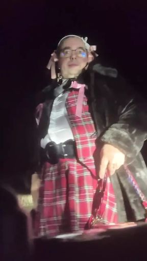In school clothes for an evening in a small parking lot