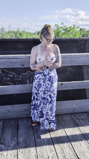 Slim blonde amateur stands and vapes while dressed for a party