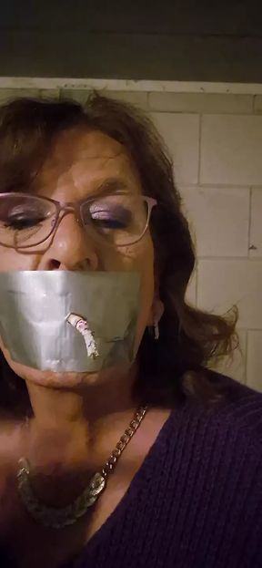 Tapegag smoking a cigarette