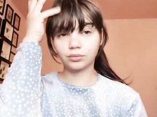 Brunette hair with natural large lips with natural color lipgloss smokin' a cigarette blowing smoke in your face