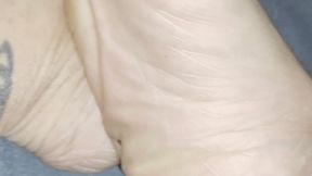 Up close wrinkled soles and calves