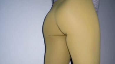 Girl pee desperation in front of closed toilet door and wetting yoga pants