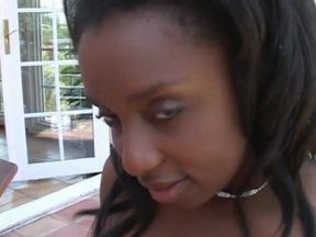 Ebony slut with big tits sucks cock like a pro