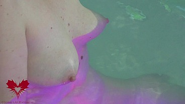 Sex in the hot tub. She masturbates and I cum on her tits.