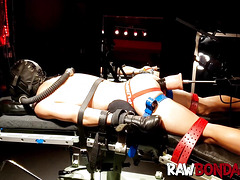 Chained jock Devin Franco lying face down being fisted in his ass