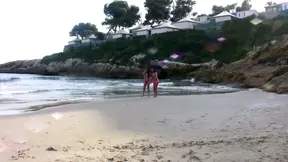 Beach babes enjoy a hot and steamy threesome on the sand