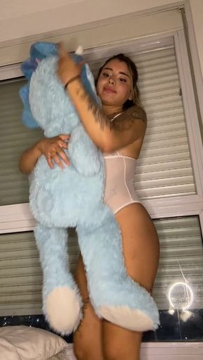 Adult video with a woman holding a blue teddy bear
