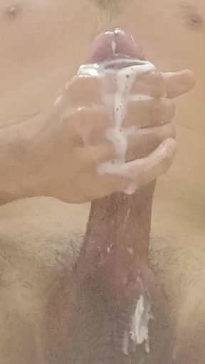 hotie boy uses soap on his big cock and big balls stroking his full length and having big orgasm