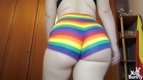 Romanian brunette shows off big natural tits and thick ass in rainbow shorts