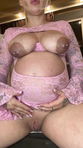 Pregnant belly showcases her juicy pussy