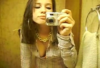 Beautiful brunette girlfriend stripteasing in the bathroom for me