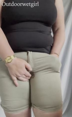 Waiting for the toilet, desperate wetting accident in shorts