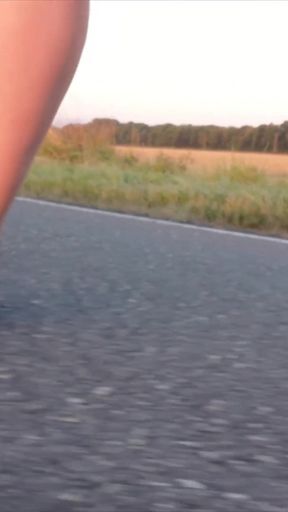 Bright Pantyhose and Beach Shoes in Puddle