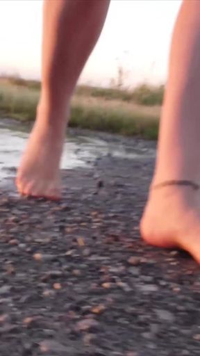 Bright Pantyhose and Beach Shoes in Puddle