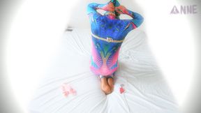 Sultry woman in colorful catsuit tied up and hogtied