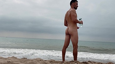 Naked swimming on public beach in Barcelona