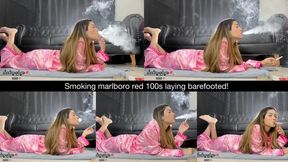 Smoking marlboro red 100s laying barefooted!