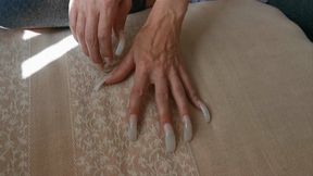 Very long nails scratch fabric