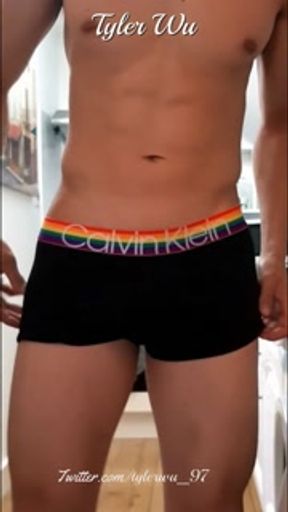 Asian boy verbal jerking and flexing in the kitchen