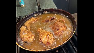 Busty Latina wife twerks in the kitchen with a tasty chicken