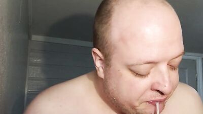 Fat dude is swallowing his huge gummy toy in this video