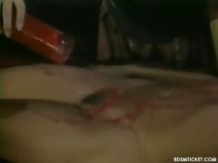 Burning hot wax coats this slave's skin