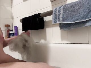 Trans chap bathing and showing off his twat