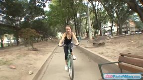 Busty solo teen riding her bike through the park