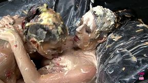 Two stunning brunette lesbians with big boobs are eating food from each others pussies