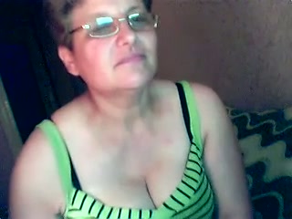 Short-haired mature skank flashes her natural boobs for the webcam