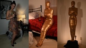Trophy Girl: Calisa Becomes a Golden Mummy Statue