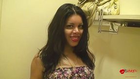 Curvy stunner trying on sexy dress in a changing room