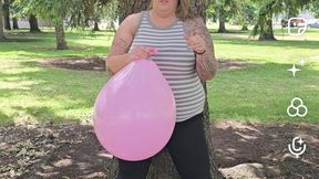 Big Pink Balloon Blow to Pop Outdoors