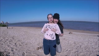 CUTE TEEN ON BEACH WITH WIND