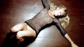 The hot blonde babe Elena Nikulina shows the nude body wrapped in the sexy fishnet cloth