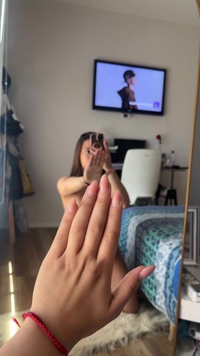 Woman taking selfie in living room