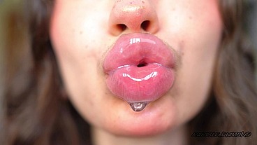 Wet messy lipgloss layers and pouting kisses