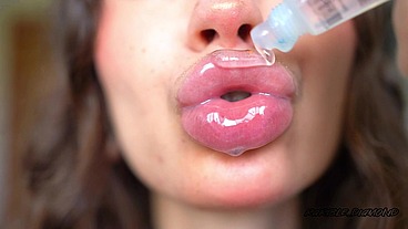 Wet messy lipgloss layers and pouting kisses