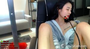Beautiful Asian babe shows her amazing tits