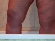 I caught a chubby mom playing with her fat pussy in the shower
