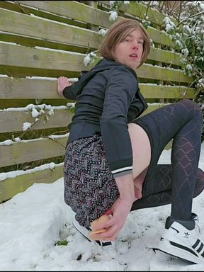 Dressed up and riding dildo in the snow