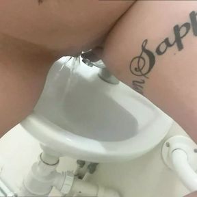 Pissing in the work sink and playing with it