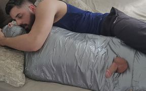 Bearded dom using mummified boy as a toy