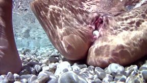Horny babe puts a rock inside her pierced pussy