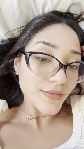 Close-up of woman with glasses and black hair