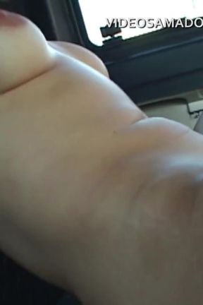 Girl with tongue piercing sucks lesbian friend&#039;s pussy in car