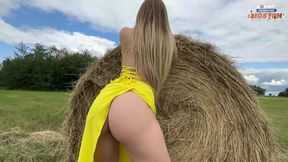 Pretty slut in a yellow dress gives head and fucks in the hayloft